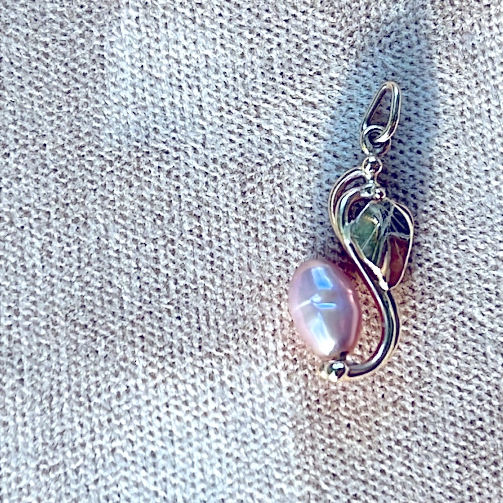 fresh water baroque pearl with a gold leaf pendant